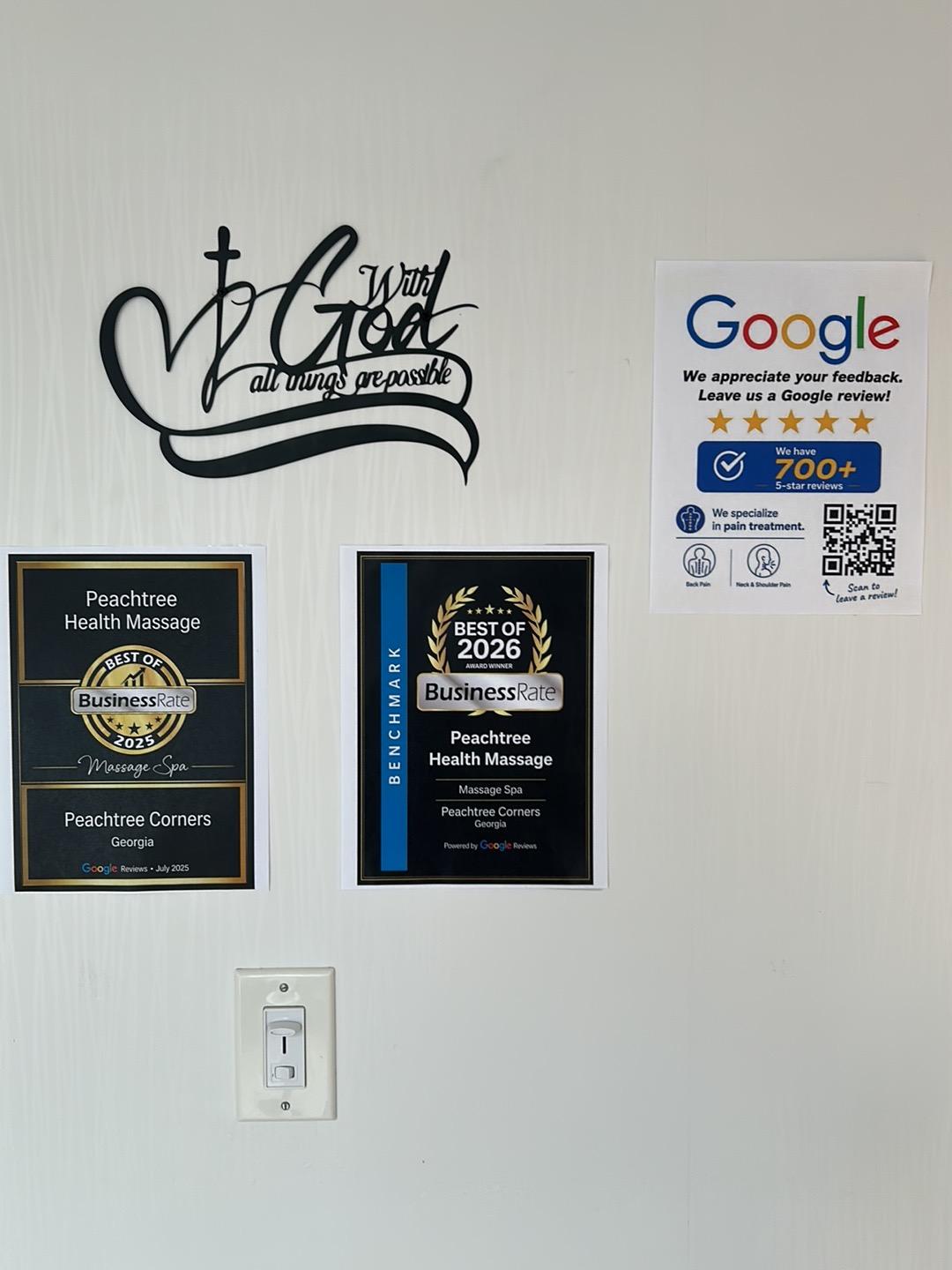 Our BusinessRate Best of 2025 and Best of 2026 plaques on the studio wall